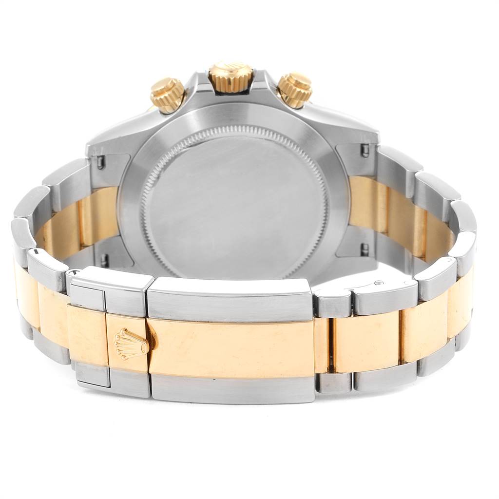 The image shows the back case and bracelet clasp of a Rolex Daytona 116523 Men's Steel and Gold (two tone) Black Dial 116523 Men's Steel and Gold (two tone) Black Dial watch with a two-tone metal finish.