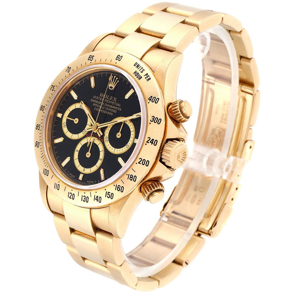 The image shows a Rolex Daytona 16528 Men's Yellow Gold Black Dial 16528 Men's Yellow Gold Black Dial watch at a slightly tilted angle, highlighting its gold case, bracelet, and black dial with three subdials.