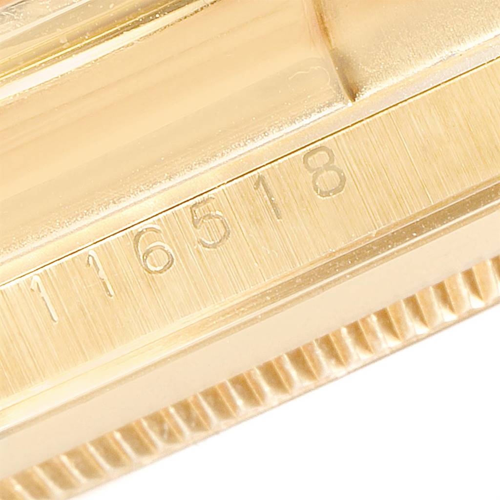 This close-up shows the model number engraving on the side of the case of a Rolex Daytona 116518 Men's Yellow Gold Champagne Dial 116518 Men's Yellow Gold Champagne Dial watch.