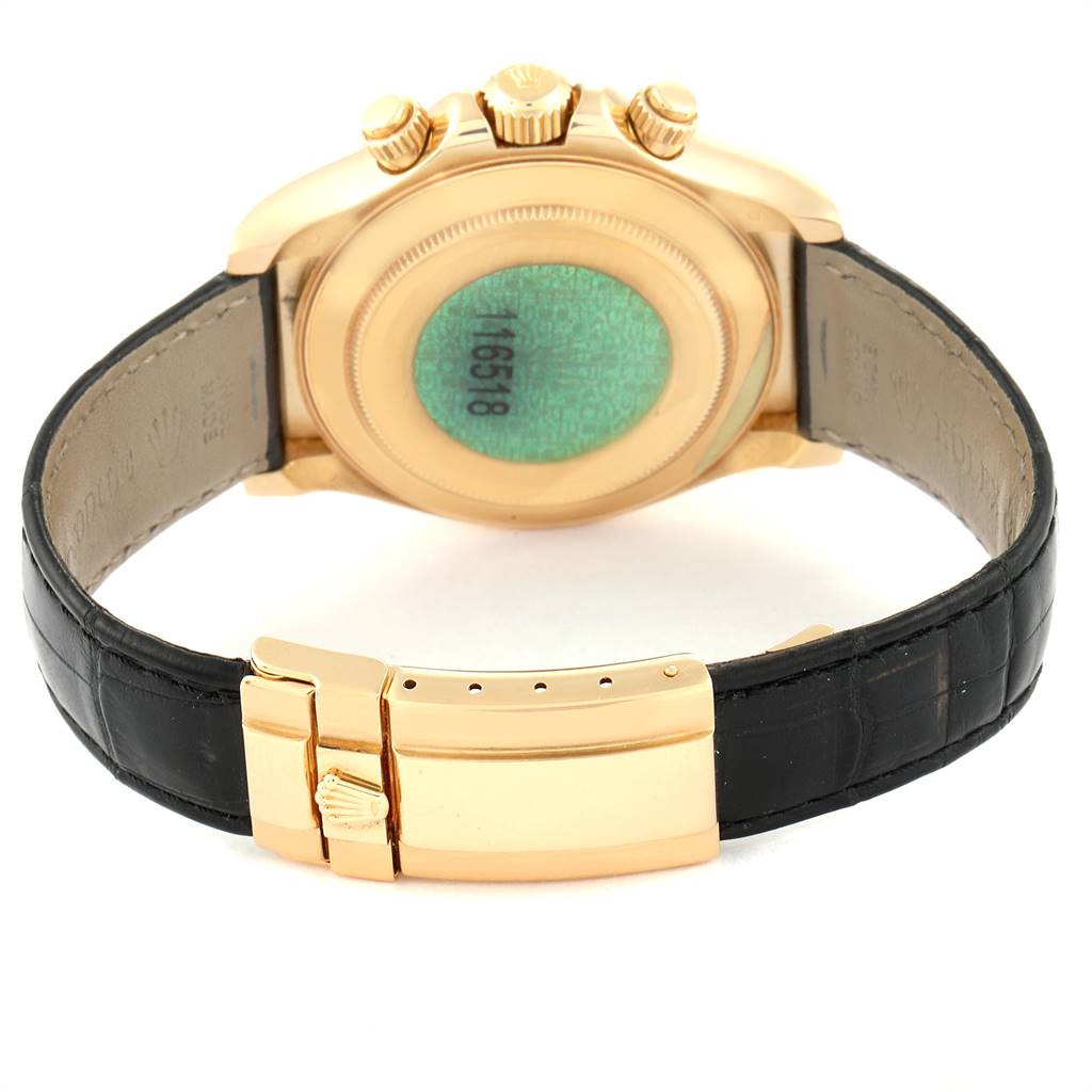gold dial black strap watch