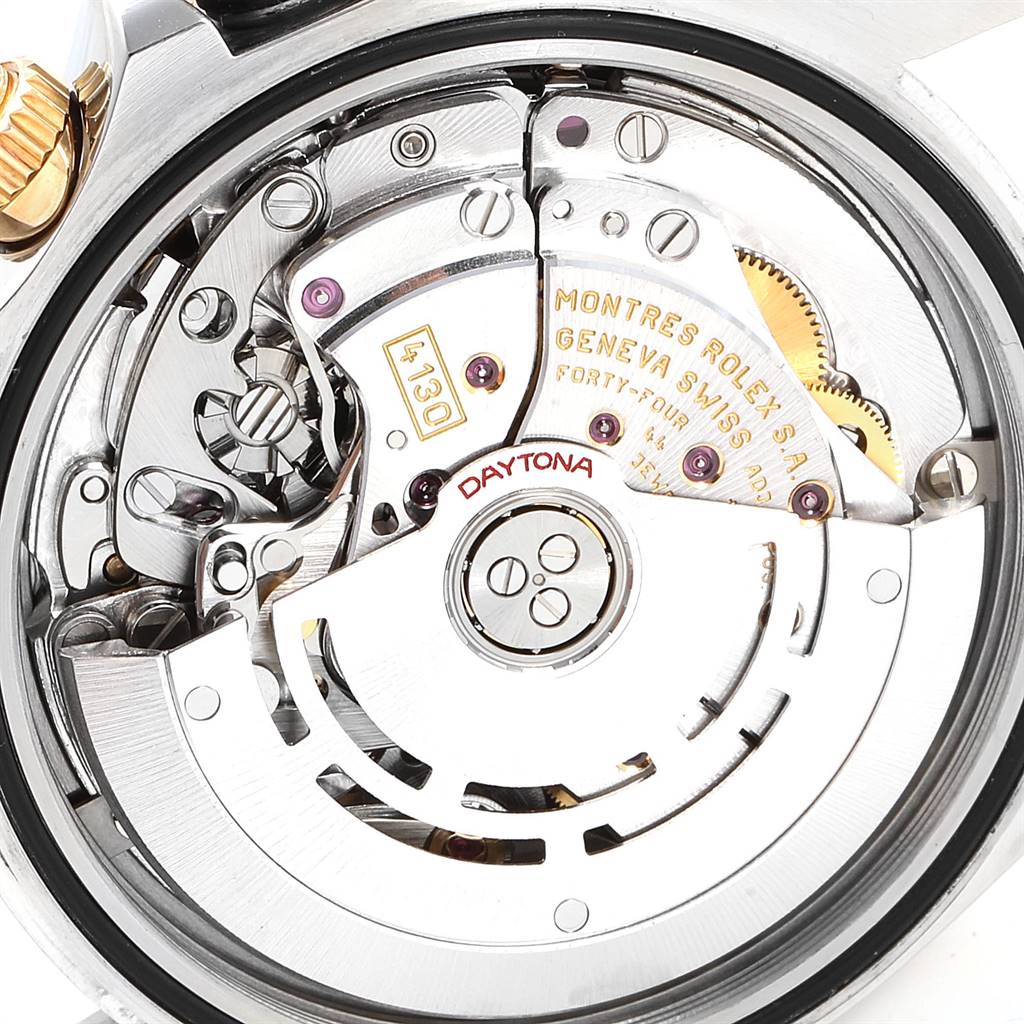 This image shows the inner mechanism of the Rolex Daytona 116523 Men's Steel and Gold (two tone) White Dial 116523 Men's Steel and Gold (two tone) White Dial watch, focusing on the movement and intricate parts from the back angle.