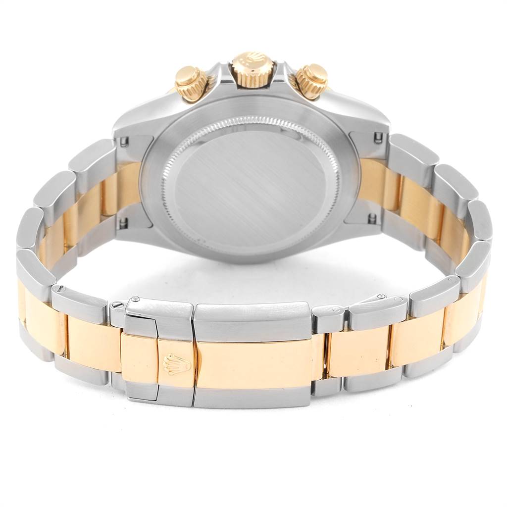 This image shows the back, bracelet, and clasp of a Rolex Daytona 116523 Men's Steel and Gold (two tone) White Dial 116523 Men's Steel and Gold (two tone) White Dial watch, featuring a two-tone metal design.
