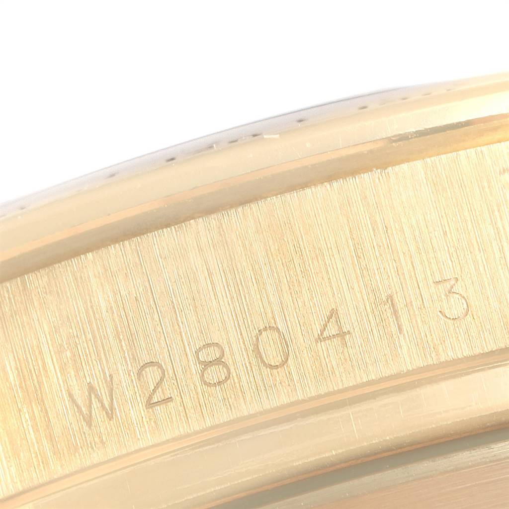This image shows a close-up of the serial number engraved on the case side of the Rolex Daytona 16528 Men's Yellow Gold Black Dial 16528 Men's Yellow Gold Black Dial watch.
