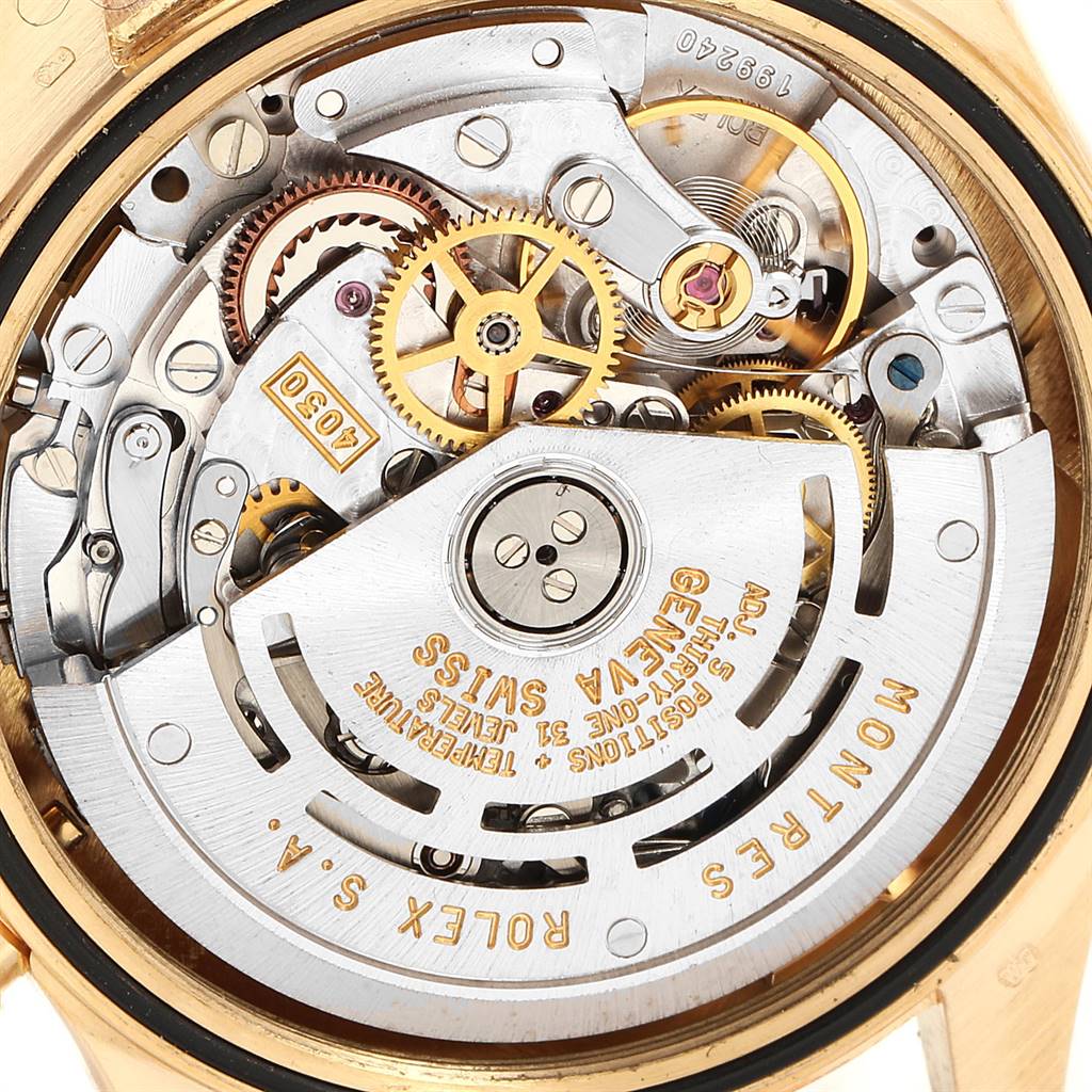 The image shows a close-up of the movement mechanism of a Rolex Daytona 16528 Men's Yellow Gold Black Dial 16528 Men's Yellow Gold Black Dial watch.