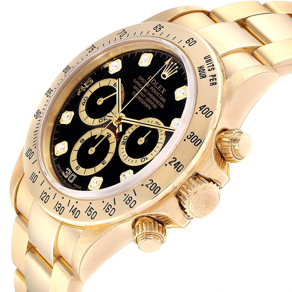 The image shows a close-up angle of a Rolex Daytona 16528 Men's Yellow Gold Black Dial 16528 Men's Yellow Gold Black Dial watch, highlighting the bezel, dial, and crown.