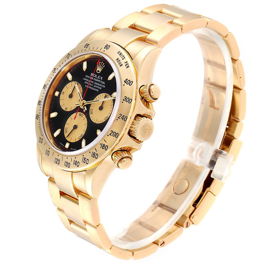 The image shows a Rolex Daytona 116528 Men's Yellow Gold Black Dial 116528 Men's Yellow Gold Black Dial watch angled to display the face, bezel, crown, and part of the bracelet.