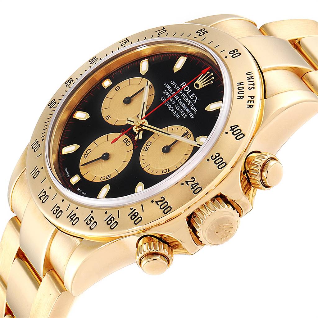 This Rolex Daytona 116528 Men's Yellow Gold Black Dial 116528 Men's Yellow Gold Black Dial watch is shown at an oblique angle, highlighting its bezel, crown, pushers, and part of the bracelet.