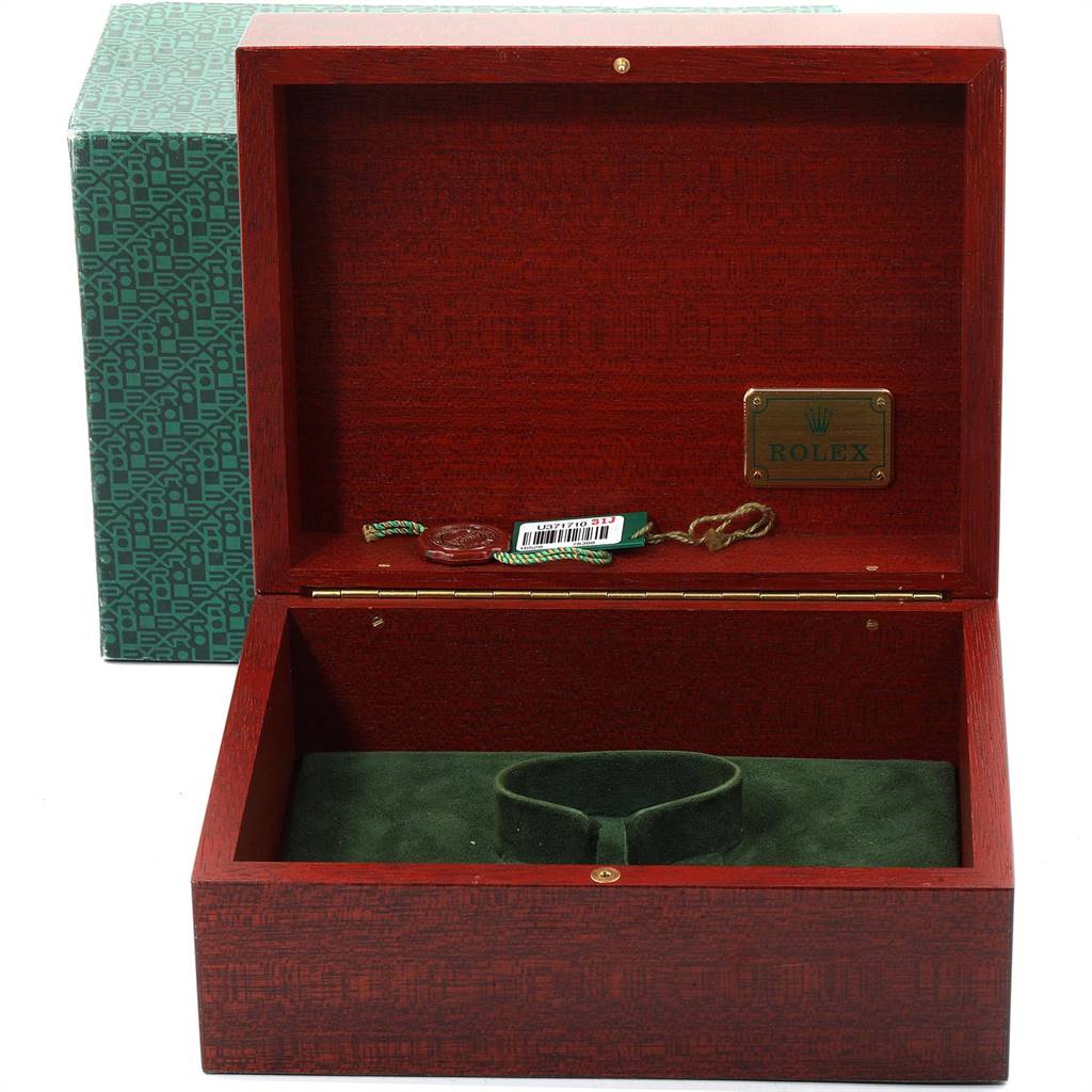 This image shows an open Rolex Daytona 16528 Men's Yellow Gold White Dial 16528 Men's Yellow Gold White Dial watch box with green felt interior and accessories, viewed from the front angle.