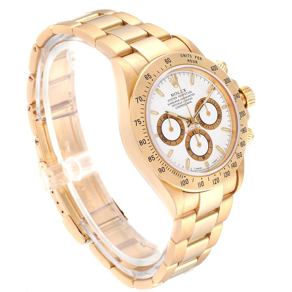 The Rolex Daytona 16528 Men's Yellow Gold White Dial 16528 Men's Yellow Gold White Dial watch is shown at an angle highlighting the bracelet, case, bezel, and face with subdials.