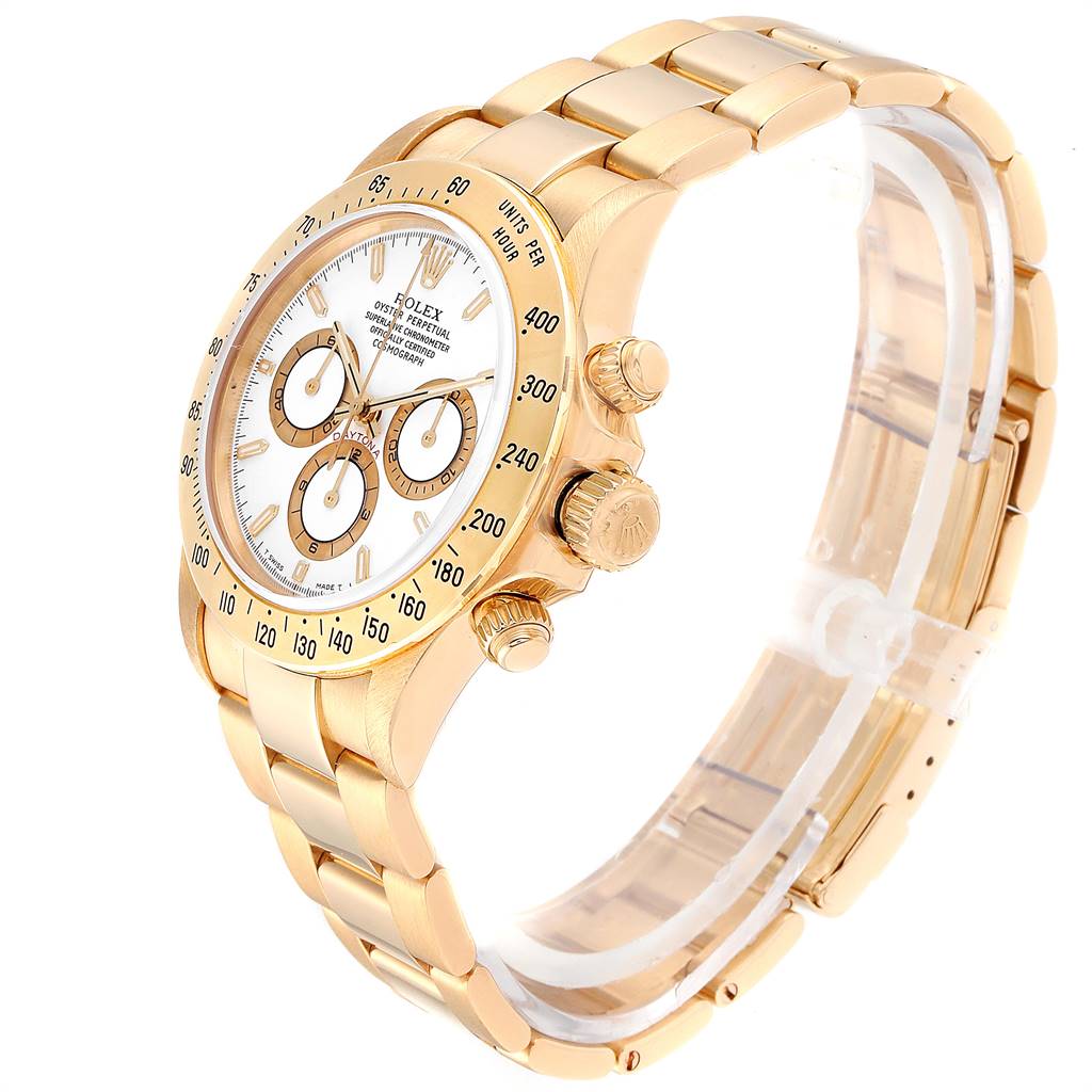 The image shows a Rolex Daytona 16528 Men's Yellow Gold White Dial 16528 Men's Yellow Gold White Dial watch at an angle, displaying its gold case, bezel, chronograph dials, and bracelet.