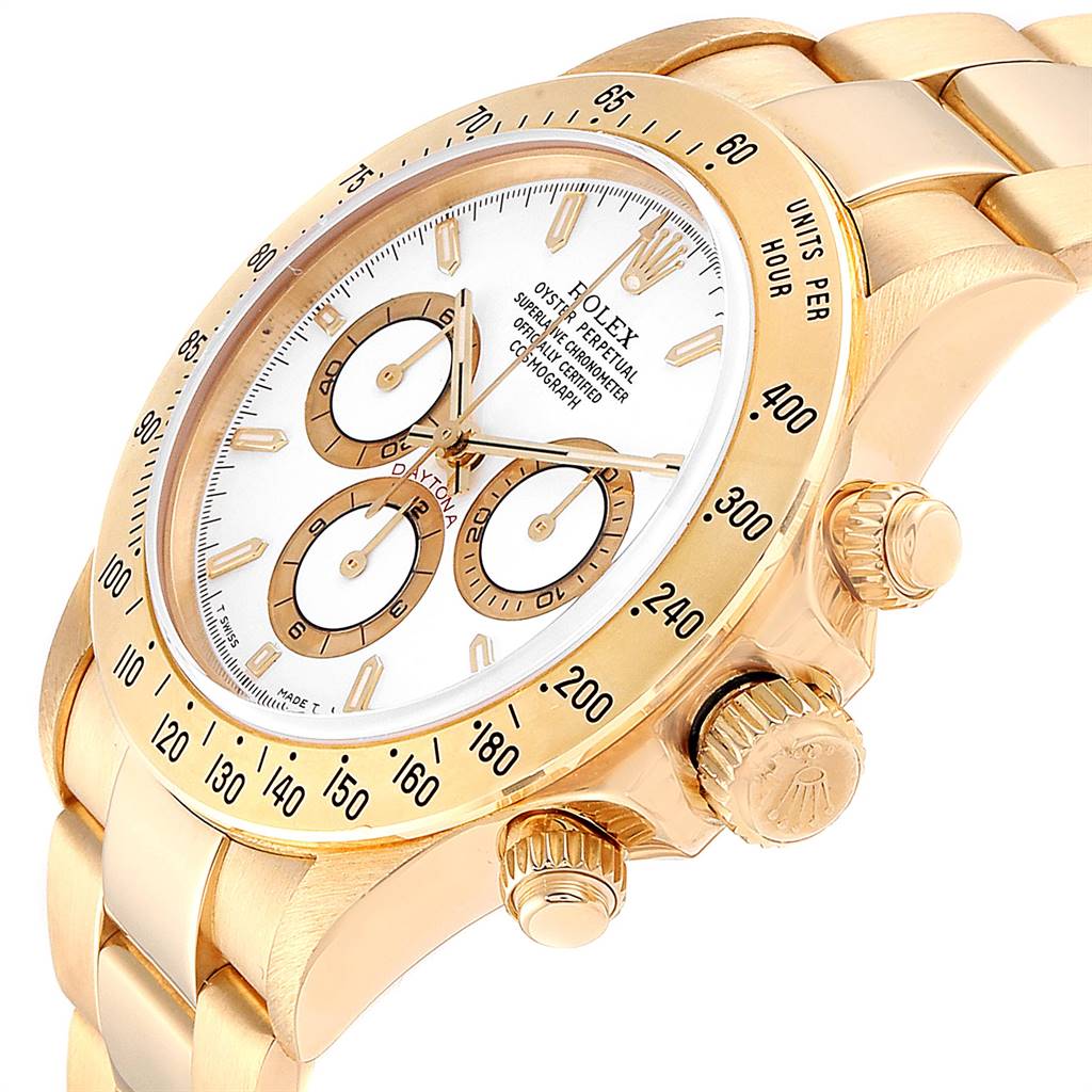 The image shows a gold Rolex Daytona 16528 Men's Yellow Gold White Dial 16528 Men's Yellow Gold White Dial watch at an angled view, highlighting its face, bezel, crown, and pushers.