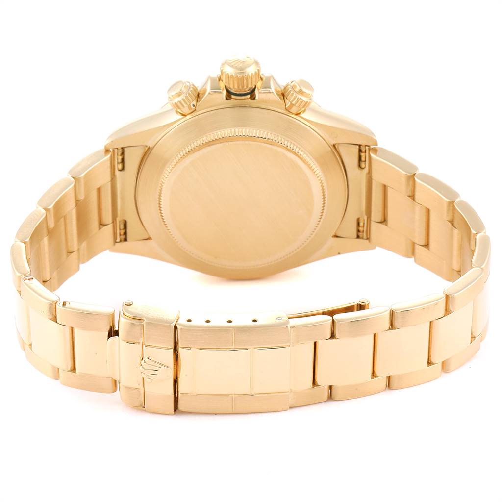 This image shows the back, bracelet, and clasp of a gold Rolex Daytona 16528 Men's Yellow Gold White Dial 16528 Men's Yellow Gold White Dial watch.
