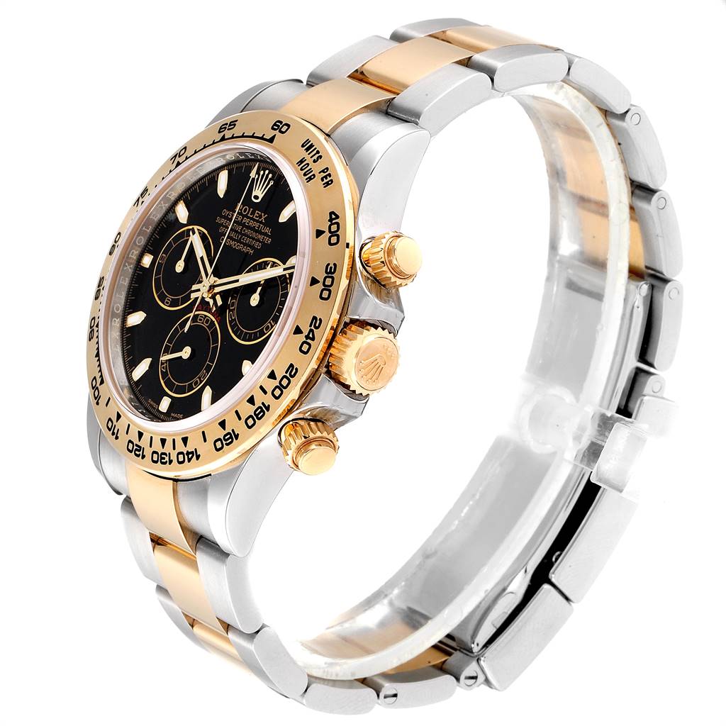 The image shows a side angle view of a Rolex Daytona 116503 Men's Steel and Gold (two tone) Black Dial 116503 Men's Steel and Gold (two tone) Black Dial watch, highlighting its bezel, crown, and part of the bracelet.