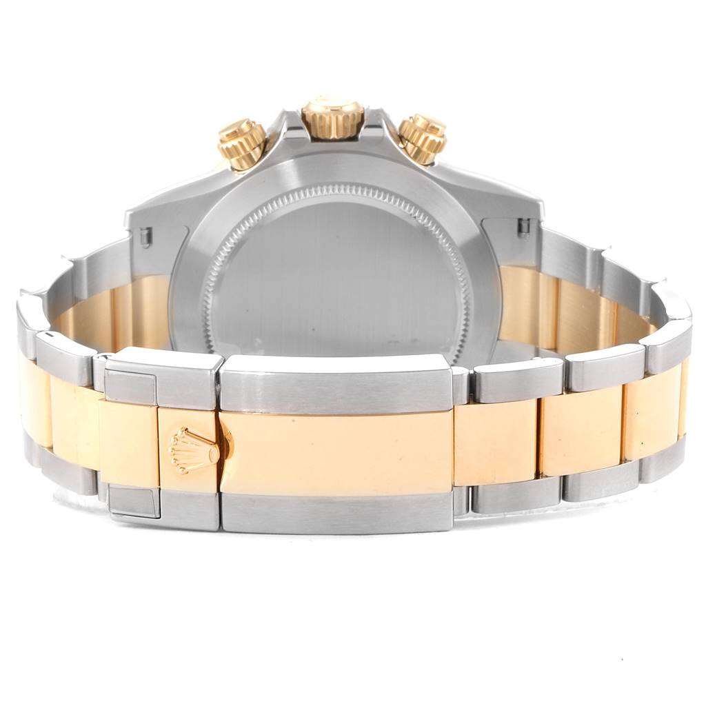 This image shows the back case, crown, and bracelet clasps of a Rolex Daytona 116503 Men's Steel and Gold (two tone) Black Dial 116503 Men's Steel and Gold (two tone) Black Dial watch.