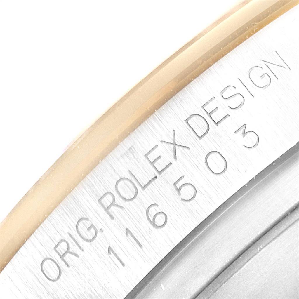 This image shows a close-up of the engraving and serial number on the case of a Rolex Daytona 116503 Men's Steel and Gold (two tone) White Dial 116503 Men's Steel and Gold (two tone) White Dial watch.