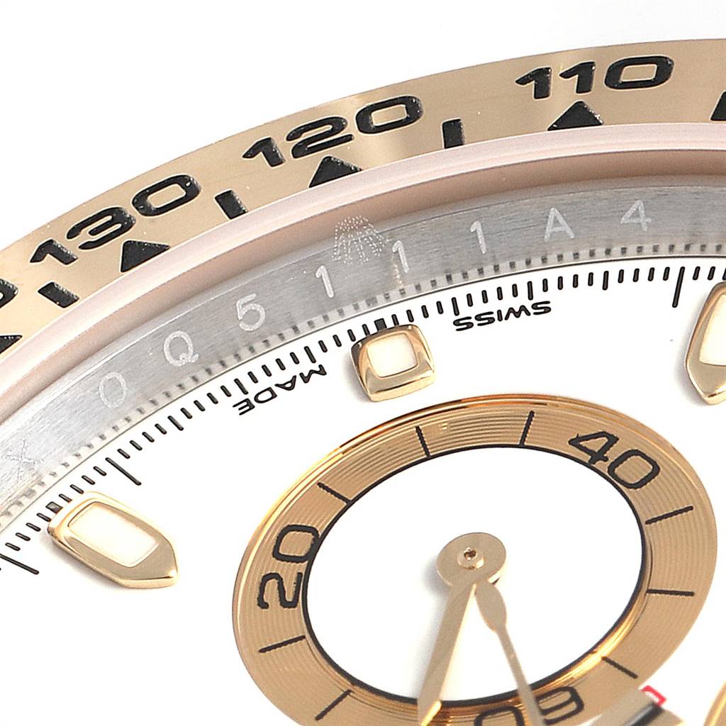 This close-up image shows a portion of the dial and bezel of a Rolex Daytona 116503 Men's Steel and Gold (two tone) White Dial 116503 Men's Steel and Gold (two tone) White Dial watch.