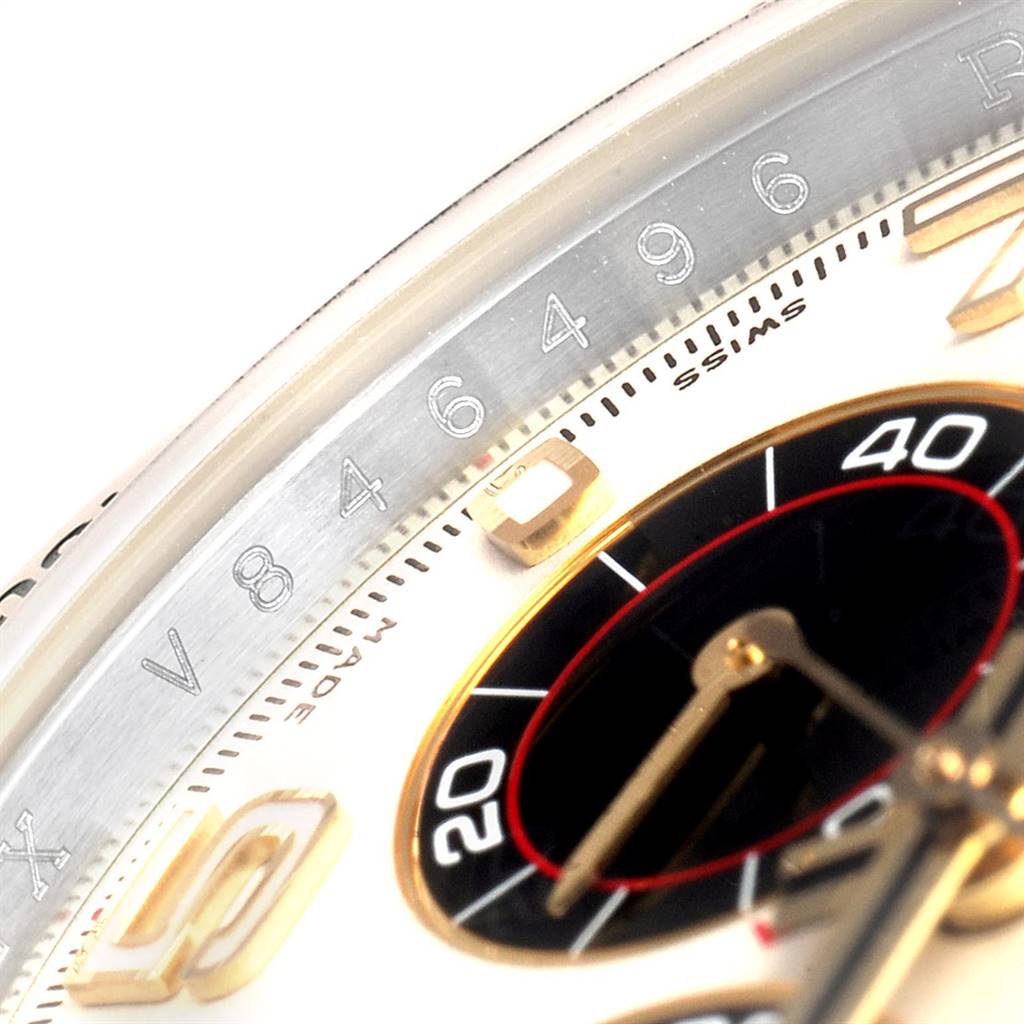This close-up shot of the Rolex Daytona 116523 Men's Steel and Gold (two tone) Silver Dial 116523 Men's Steel and Gold (two tone) Silver Dial watch shows part of the bezel, dial, and sub-dial at an angled perspective.