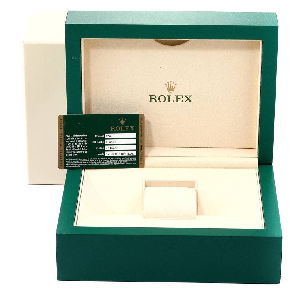 This image shows a Rolex Daytona 116523 Men's Steel and Gold (two tone) Silver Dial 116523 Men's Steel and Gold (two tone) Silver Dial watch box, open, with an authenticity card inside.