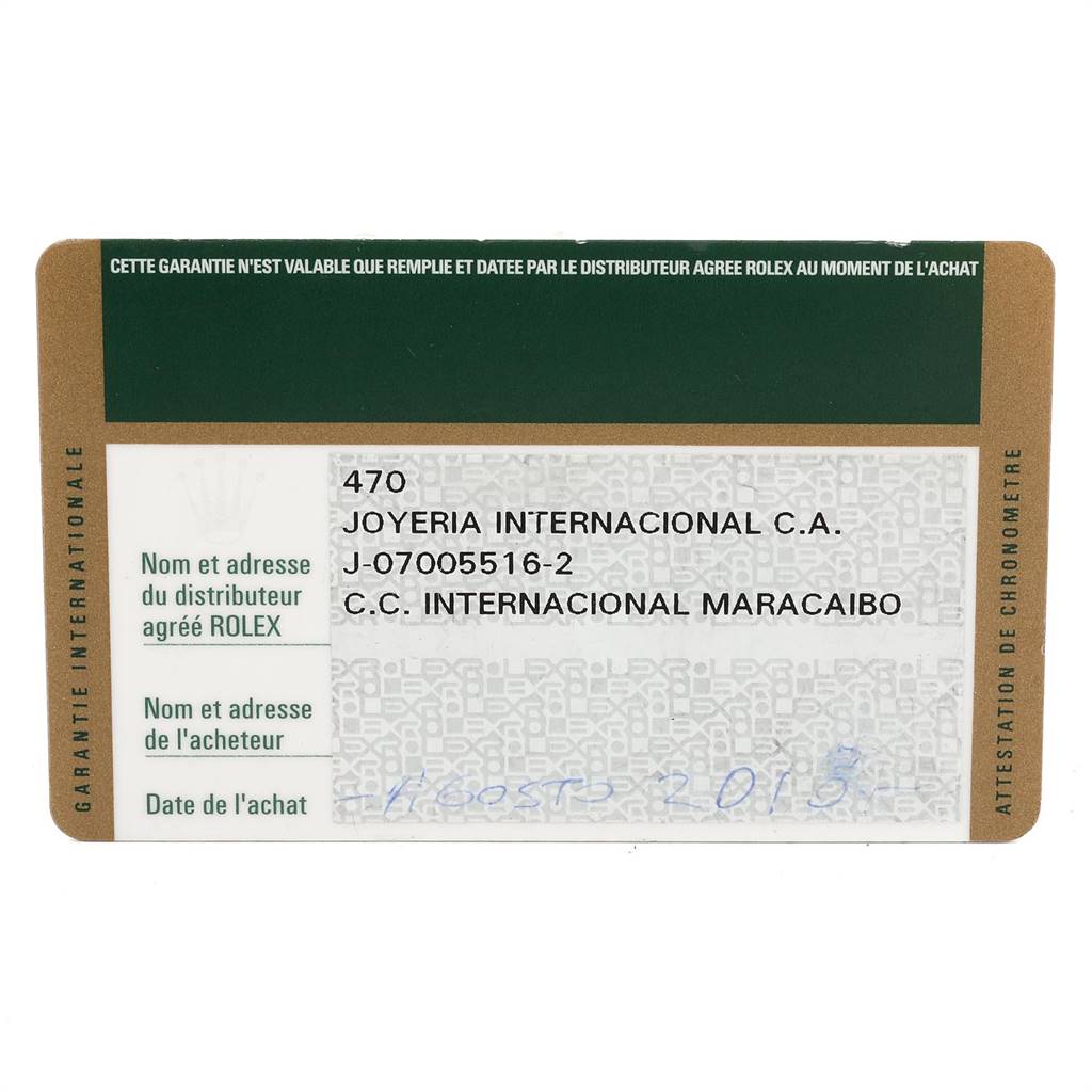 This is a close-up image of a guarantee card for a Rolex Daytona 116523 Men's Steel and Gold (two tone) Silver Dial 116523 Men's Steel and Gold (two tone) Silver Dial watch.