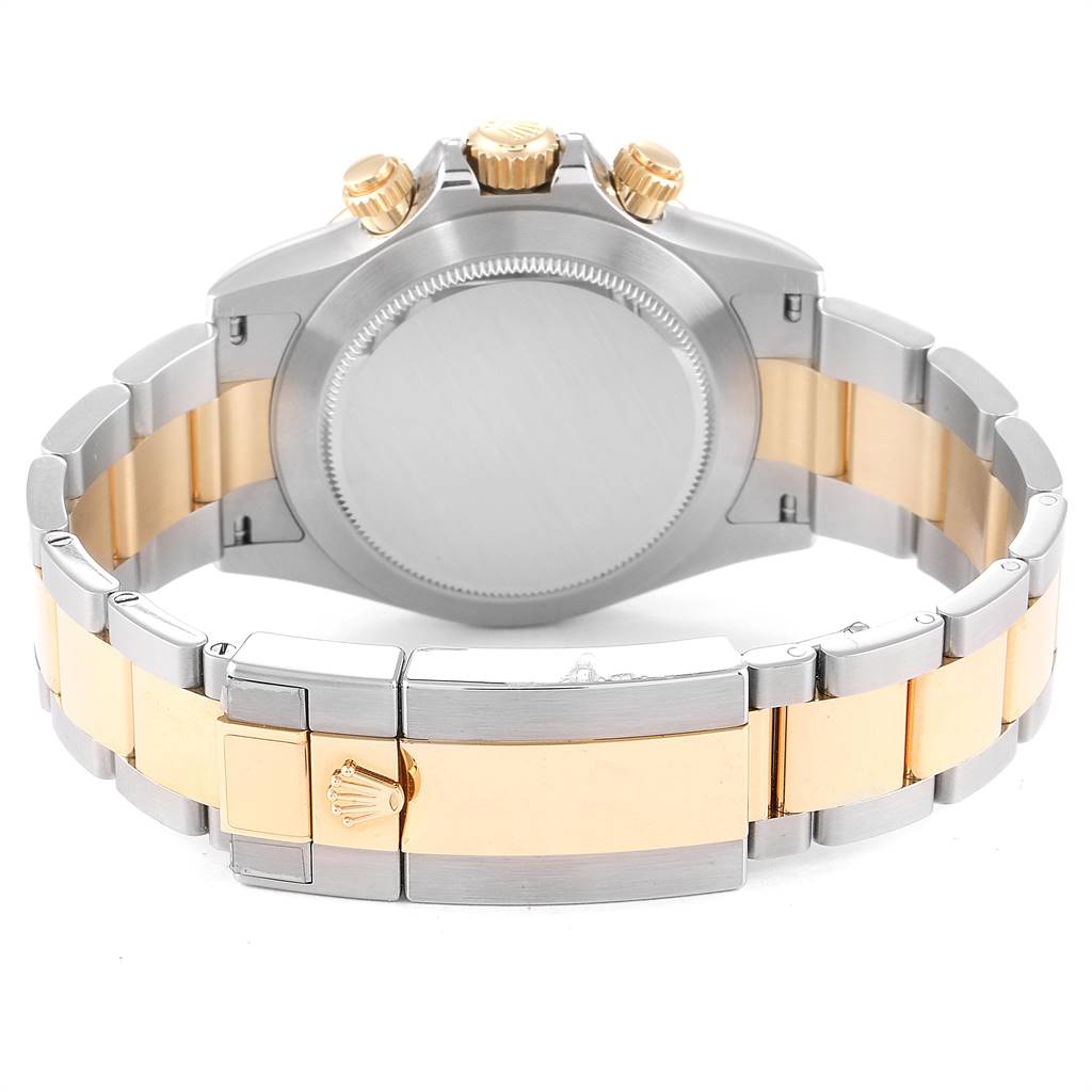 The image shows the back view of a Rolex Daytona 116503 Men's Steel and Gold (two tone) White Dial 116503 Men's Steel and Gold (two tone) White Dial watch, highlighting its case, crown, and two-tone bracelet.