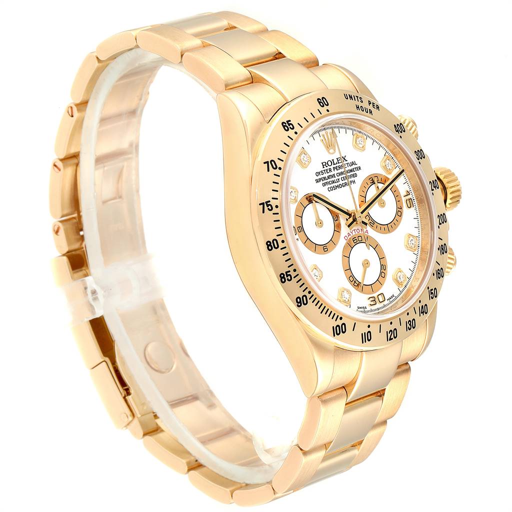 The Rolex Daytona 116528 Men's Yellow Gold White Dial 116528 Men's Yellow Gold White Dial watch is shown at an angle highlighting the bracelet, case, bezel, and dial with subdials.