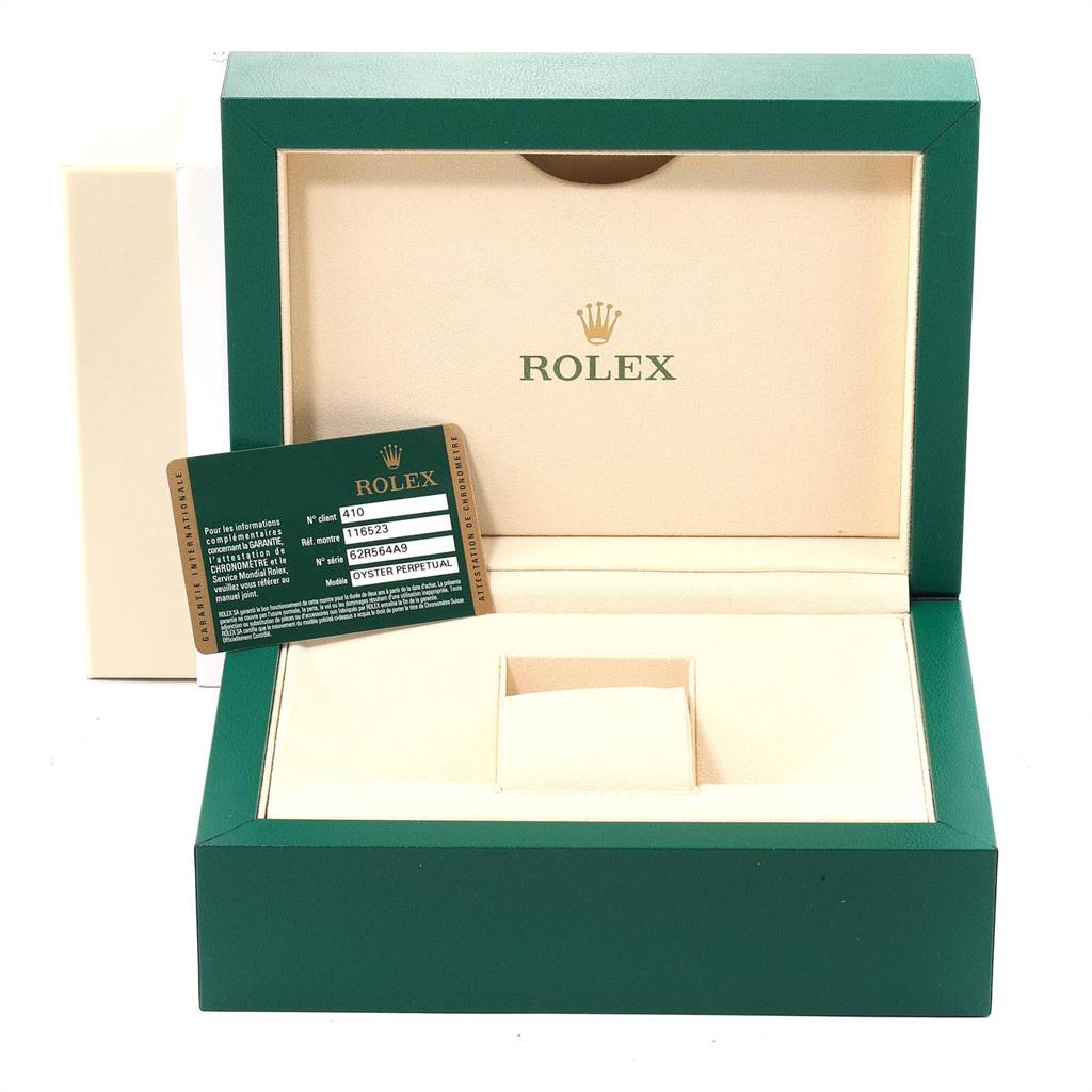 This image shows an open Rolex Daytona 116523 Men
s Steel and Gold (two tone) Black Dial 116523 Men
s Steel and Gold (two tone) Black Dial watch box with a Rolex certification card displayed next to it.