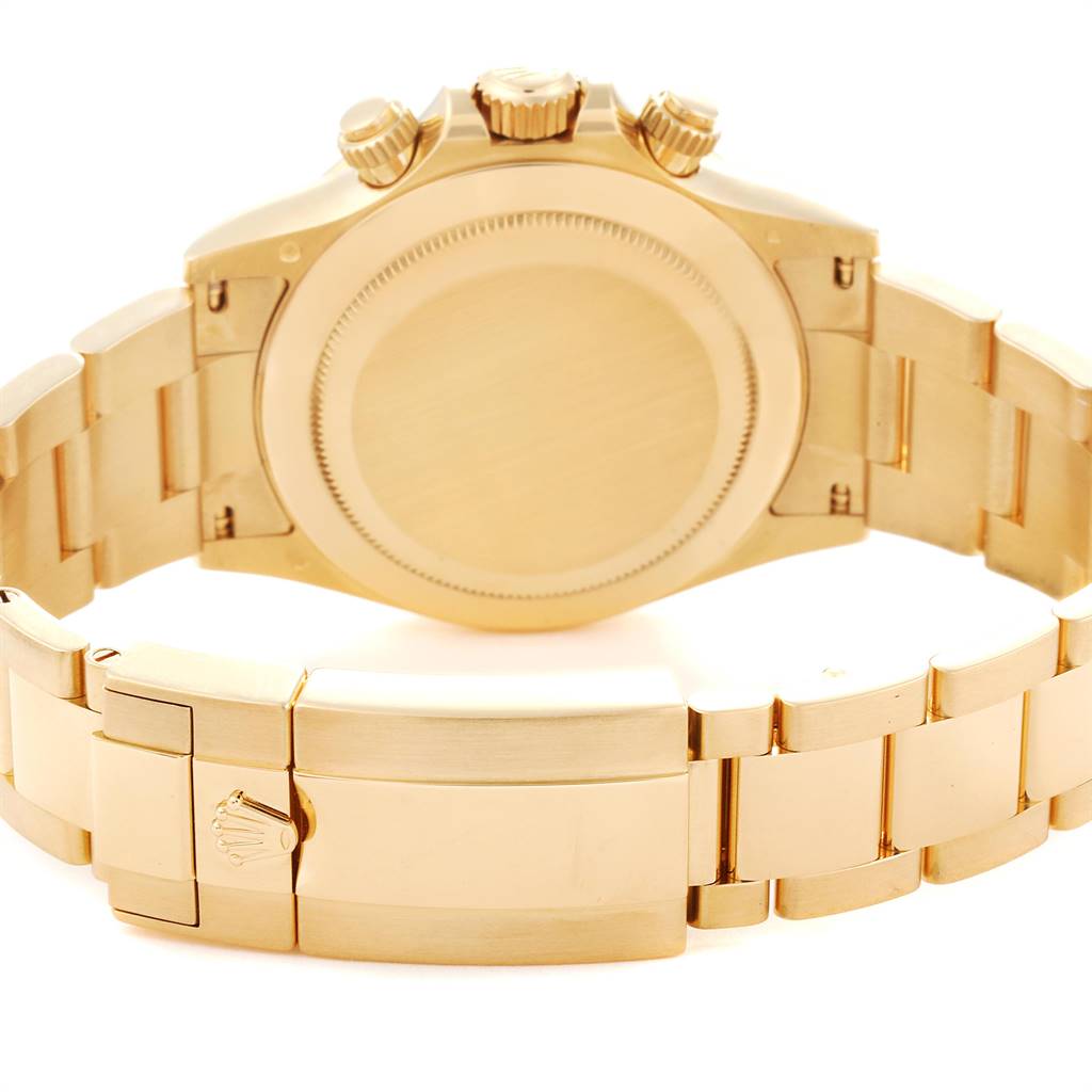 The image shows the back and bracelet clasp of a Rolex Daytona 116508 Men's Yellow Gold Green Dial 116508 Men's Yellow Gold Green Dial watch at an angle revealing the case back and bracelet links.