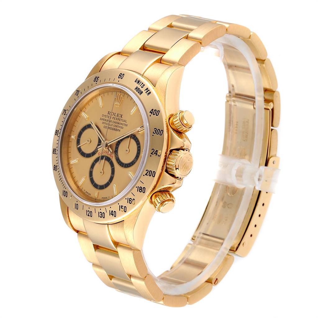 The image shows a Rolex Daytona 16528 Men
s Yellow Gold Champagne Dial 16528 Men
s Yellow Gold Champagne Dial watch at a 3/4 angle, highlighting its yellow gold case, bezel, bracelet, and chronograph subdials.