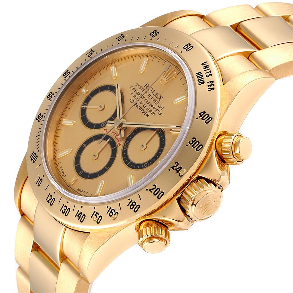 The image shows a Rolex Daytona 16528 Men
s Yellow Gold Champagne Dial 16528 Men
s Yellow Gold Champagne Dial watch at an angled side view, highlighting its bezel, dial, crown, and part of the bracelet.