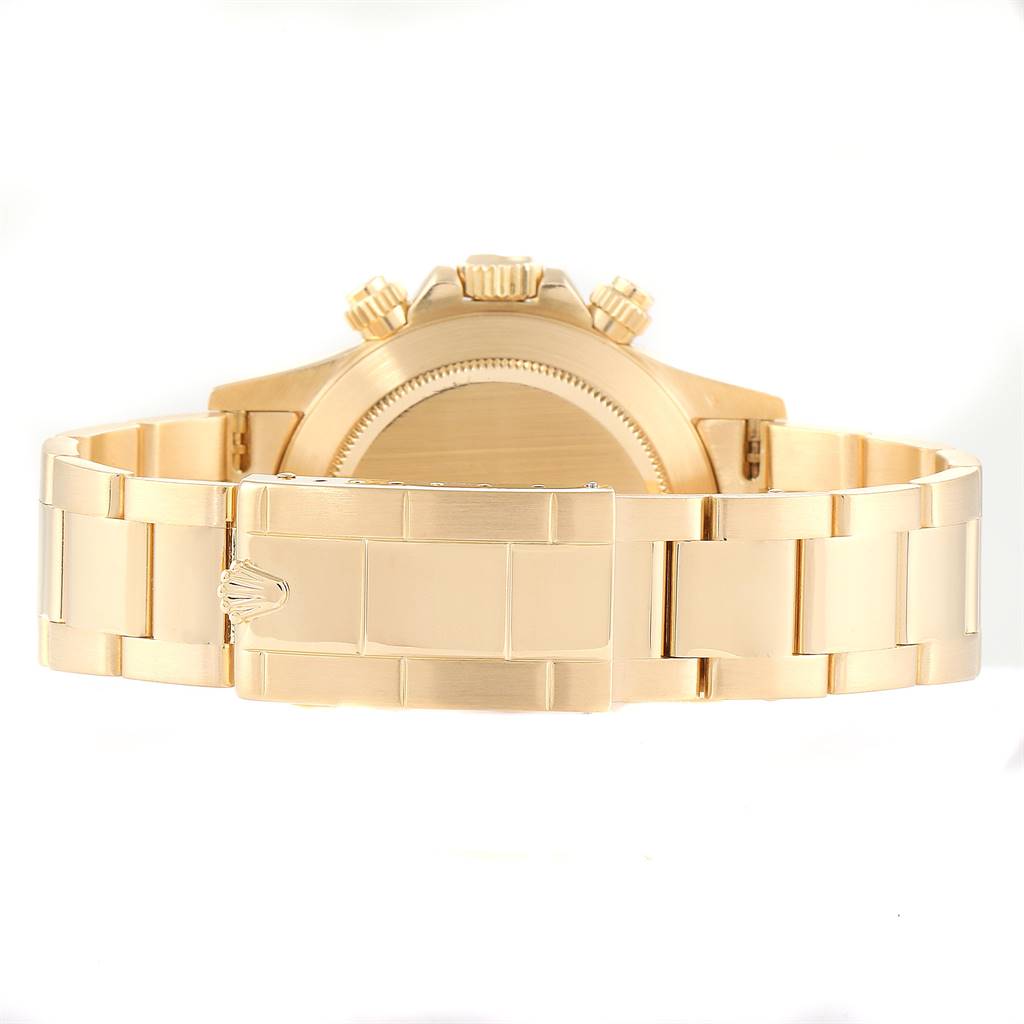 This image shows the back view of a Rolex Daytona 16528 Men
s Yellow Gold Champagne Dial 16528 Men
s Yellow Gold Champagne Dial, highlighting its gold case, clasp, and bracelet.