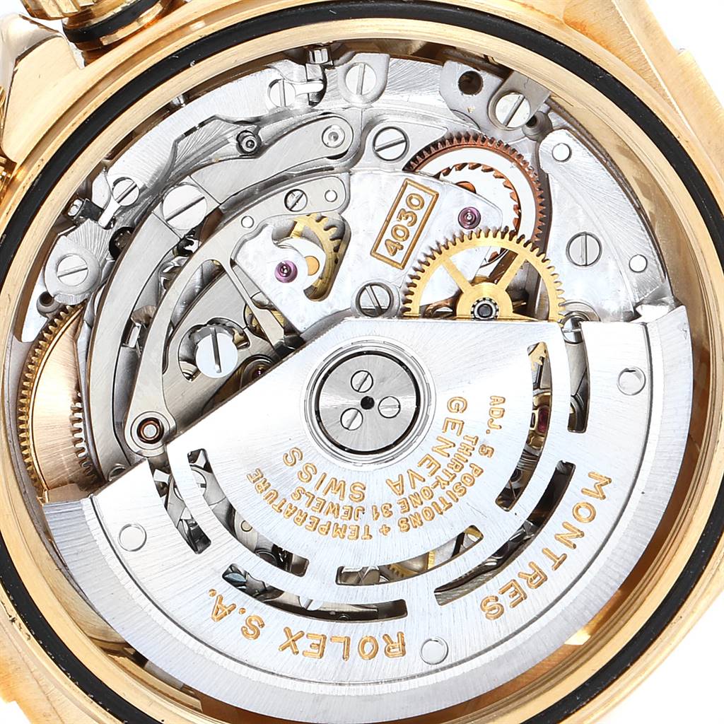 The image shows the internal mechanism of the Rolex Daytona 16518 Men's Yellow Gold White Dial 16518 Men's Yellow Gold White Dial watch, highlighting the gears, rotors, and intricate components.