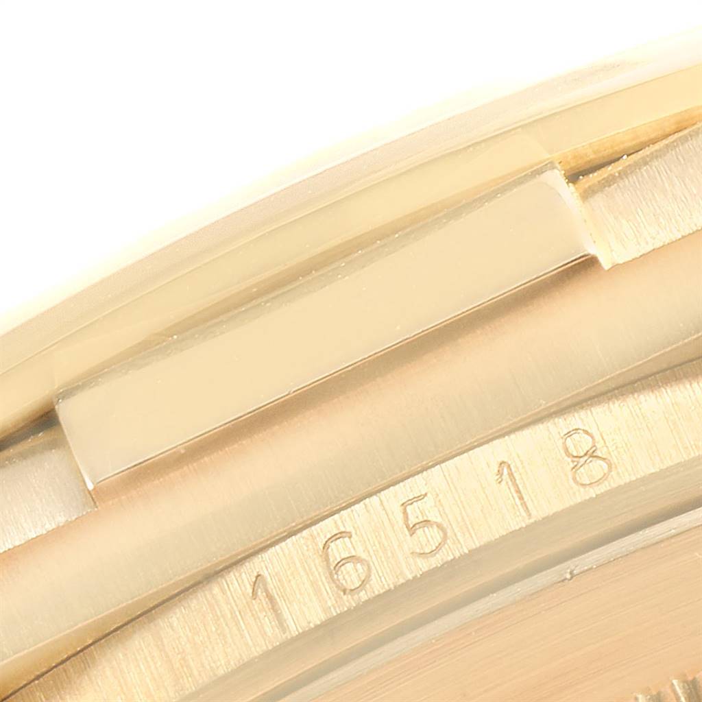 This image shows a close-up of the bezel and case of a Rolex Daytona 16518 Men's Yellow Gold White Dial 16518 Men's Yellow Gold White Dial watch, highlighting the model number.