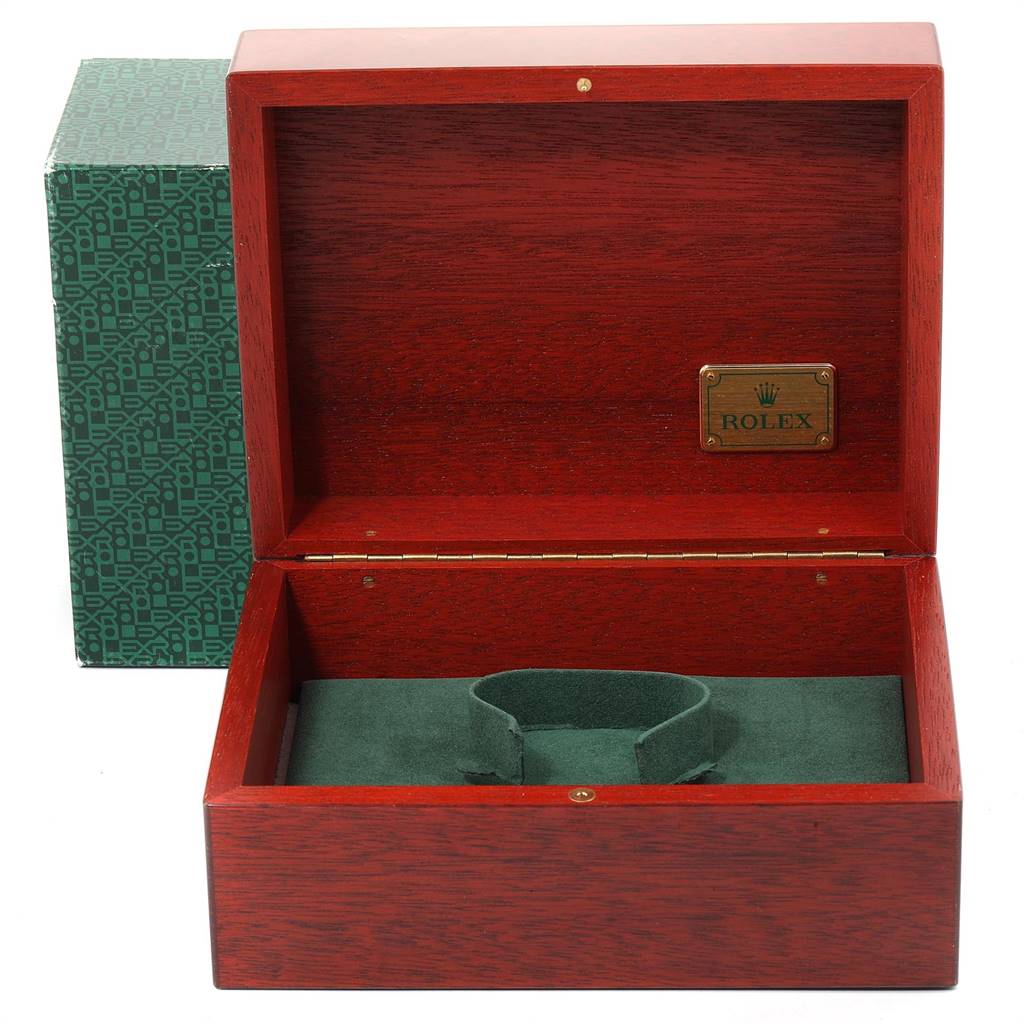 This image shows an open wooden Rolex Daytona 16518 Men's Yellow Gold White Dial 16518 Men's Yellow Gold White Dial watch box with a green interior and an outer green patterned box.