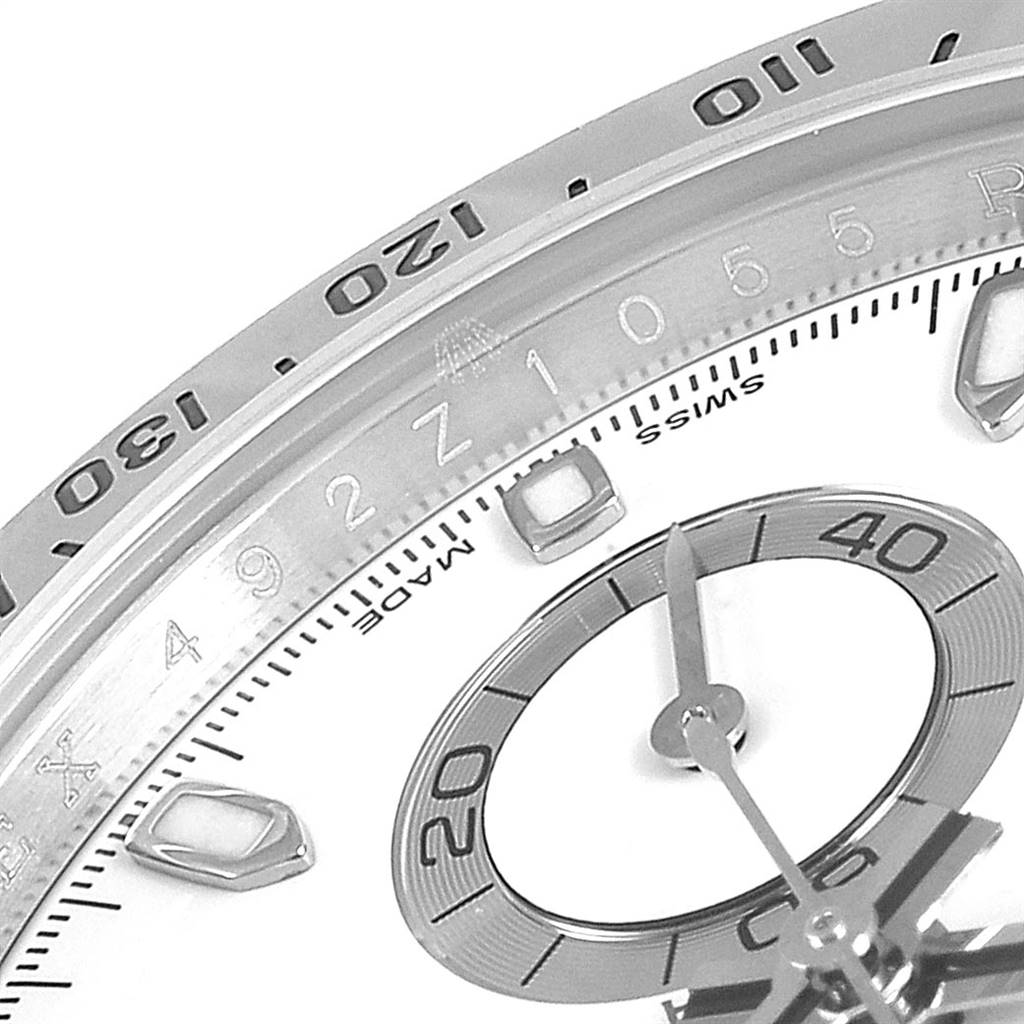 This image shows a close-up of the dial and bezel of a Rolex Daytona 116520 Men's Stainless Steel White Dial 116520 Men's Stainless Steel White Dial watch, indicating minute markers and subdials.
