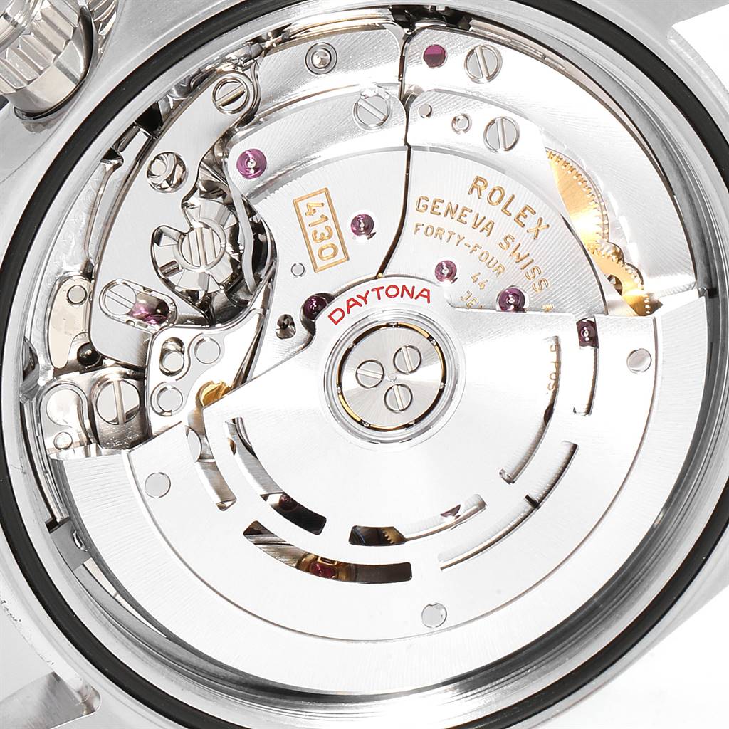 This image shows the movement mechanism of a Rolex Daytona 116500 Men's Stainless Steel White Dial 116500 Men's Stainless Steel White Dial watch, highlighting its intricate internal parts and engravings.
