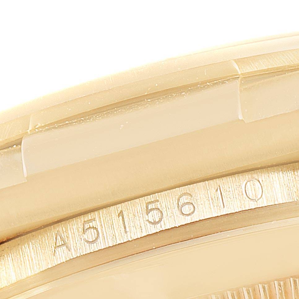This close-up image shows the serial number area of a Rolex Daytona 16518 Men's Yellow Gold White Dial 16518 Men's Yellow Gold White Dial watch.