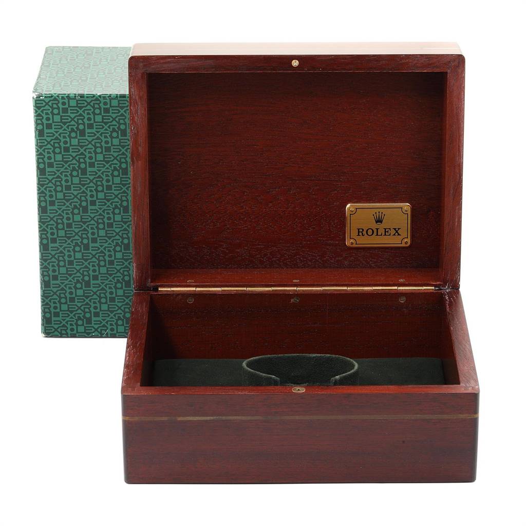 This image shows an open Rolex Daytona 16518 Men's Yellow Gold White Dial 16518 Men's Yellow Gold White Dial watch box with a green patterned outer box in the background.