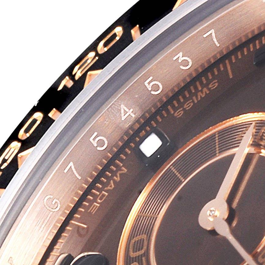Close-up view of the Rolex Daytona 116515LN Men's Rose Gold Brown Dial 116515LN Men's Rose Gold Brown Dial dial and bezel showing hour markers and part of the watch hands.