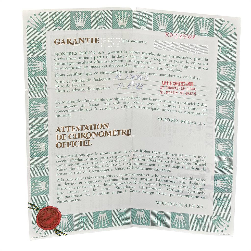 This image shows the warranty and certificate papers for a Rolex Daytona 16523 Men's Steel and Gold (two tone) Champagne Dial 16523 Men's Steel and Gold (two tone) Champagne Dial watch.