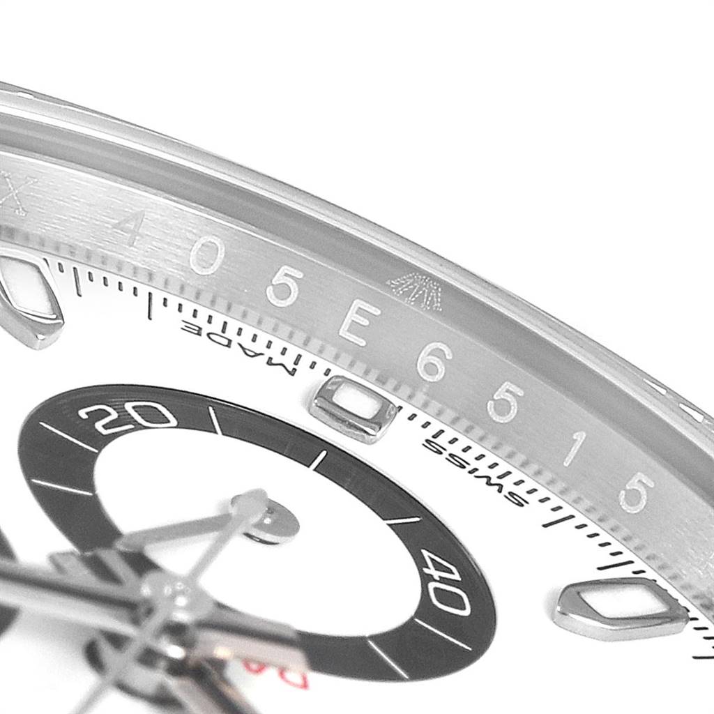 The image shows a close-up angle focusing on the bezel and part of the dial of a Rolex Daytona 116500 Men's Stainless Steel White Dial 116500 Men's Stainless Steel White Dial watch.