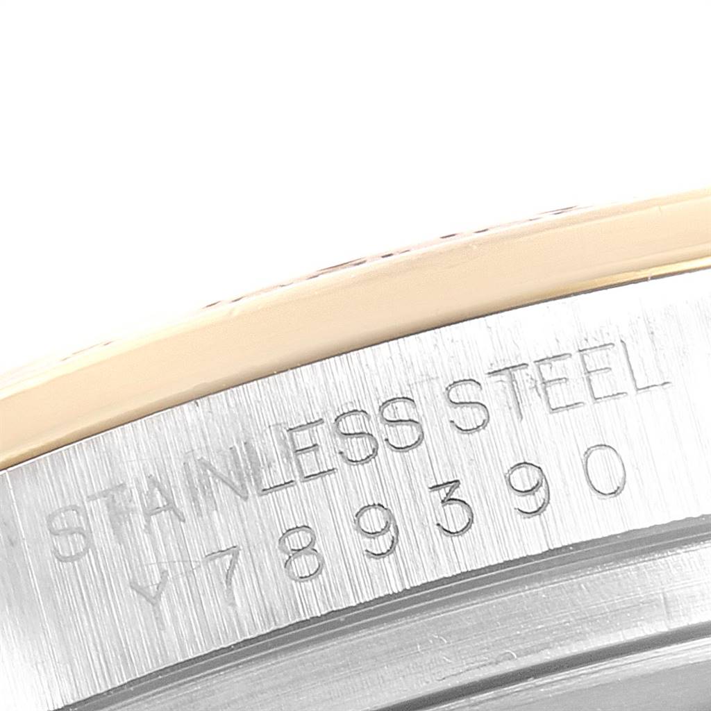 This close-up shows the engraved stainless steel case with part of the serial number of the Rolex Daytona 116523 Men
s Steel and Gold (two tone) Mother of Pearl Dial 116523 Men
s Steel and Gold (two tone) Mother of Pearl Dial watch.