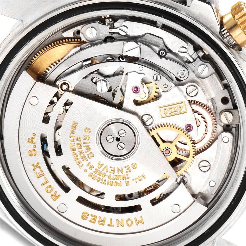 This image shows a close-up of the movement mechanism of a Rolex Daytona 16523 Men's Steel and Gold (two tone) White Dial 16523 Men's Steel and Gold (two tone) White Dial watch, highlighting its internal components.