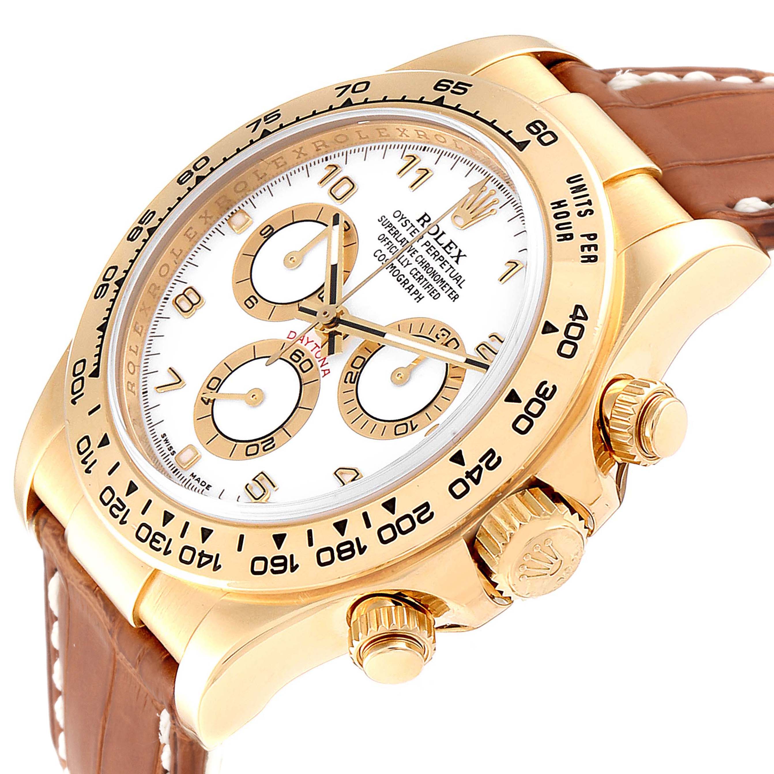 The Rolex Daytona 116518 Men's Yellow Gold White Dial 116518 Men's Yellow Gold White Dial watch is shown at an angled side view, highlighting its white dial, multiple subdials, gold case, and brown leather strap.