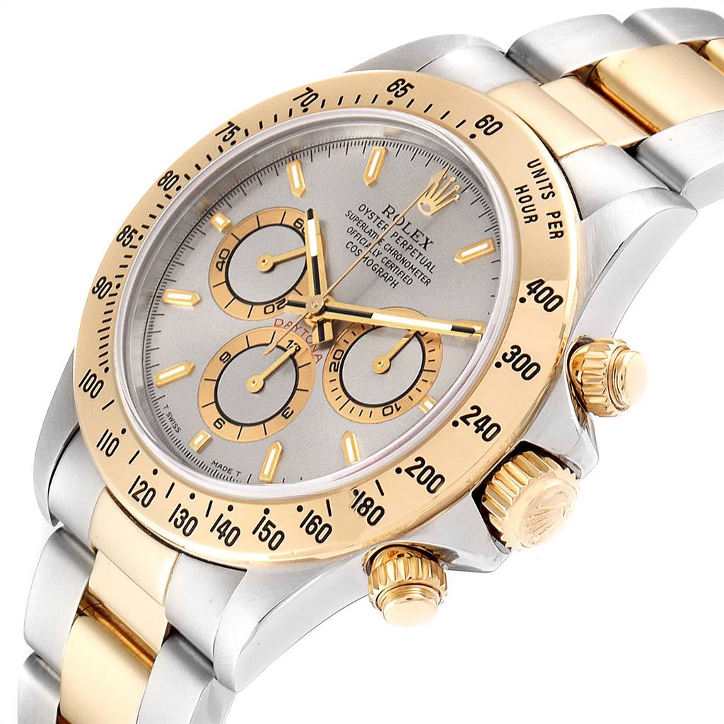 The image shows a close-up angle of a Rolex Daytona 16523 Men's Steel and Gold (two tone) Grey Dial 16523 Men's Steel and Gold (two tone) Grey Dial watch, highlighting the dial, bezel, subdials, pushers, and crown.