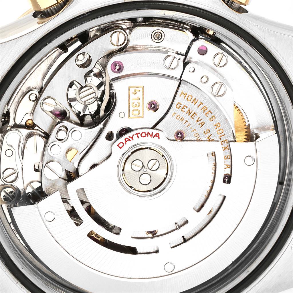 This image shows the mechanical movement of a Rolex Daytona 116523 Men's Steel and Gold (two tone) Black Dial 116523 Men's Steel and Gold (two tone) Black Dial watch, viewed from the back, highlighting intricate gears and inscriptions.