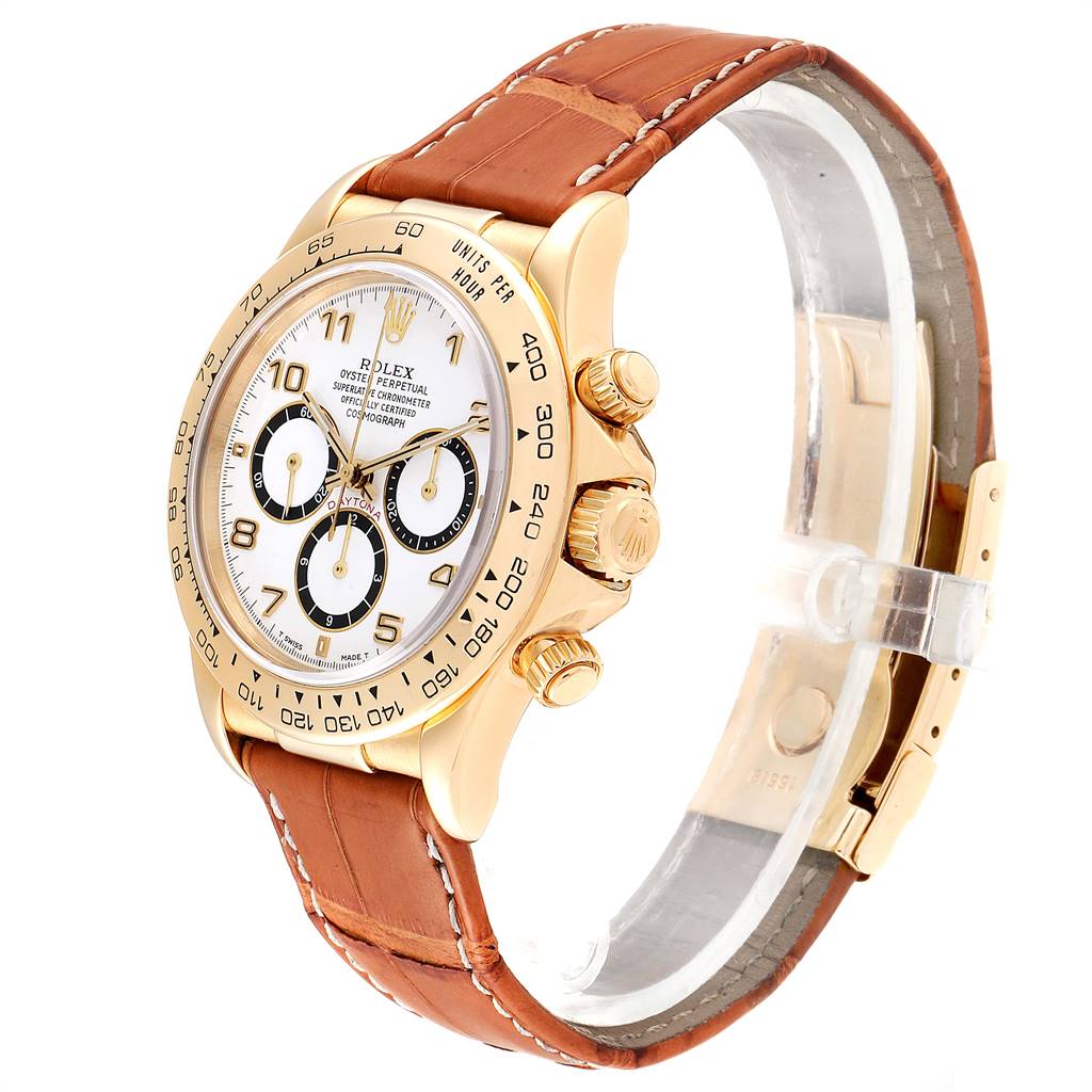 The Rolex Daytona 16518 Men's Yellow Gold White Dial 16518 Men's Yellow Gold White Dial watch is shown at a three-quarter angle, displaying its face, bezel, crown, and brown leather strap.