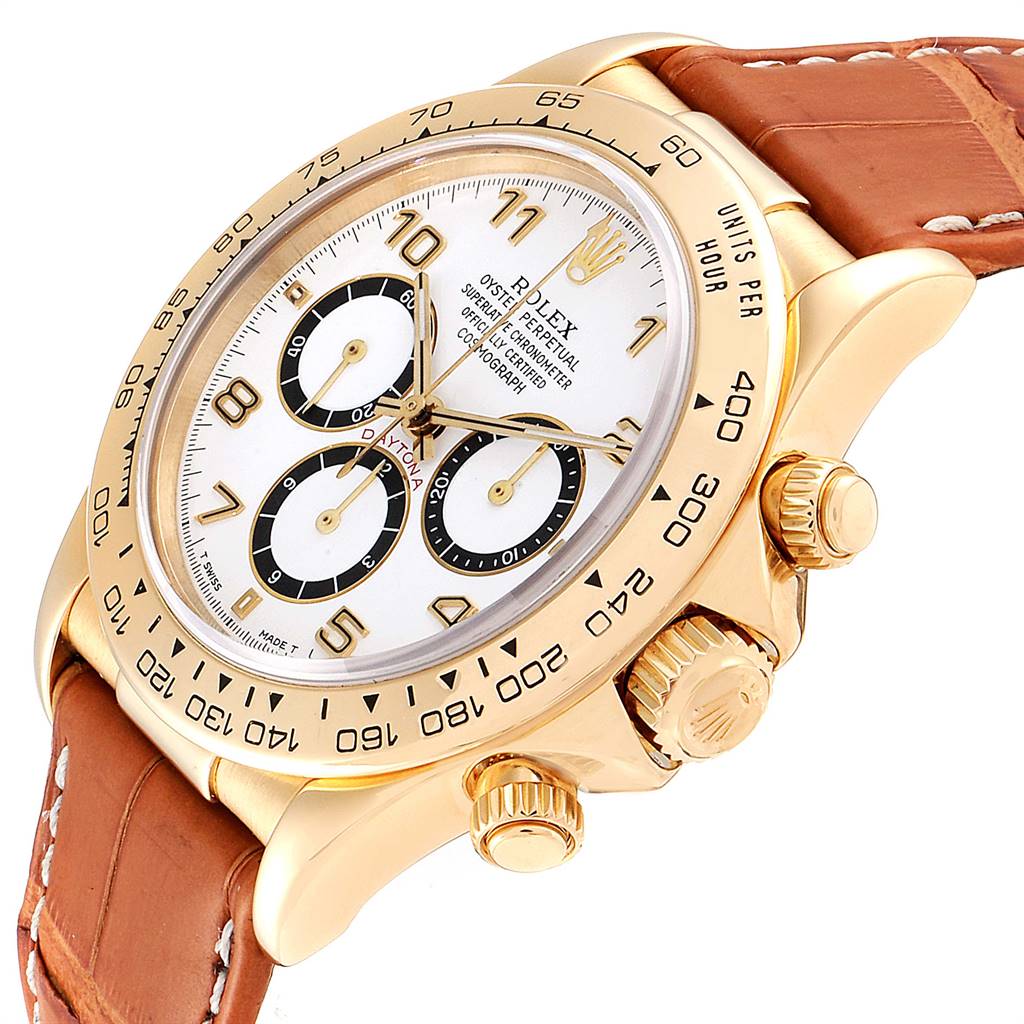 The image shows a Rolex Daytona 16518 Men's Yellow Gold White Dial 16518 Men's Yellow Gold White Dial watch angled slightly from the side, showcasing its dial, bezel, crown, and leather strap.