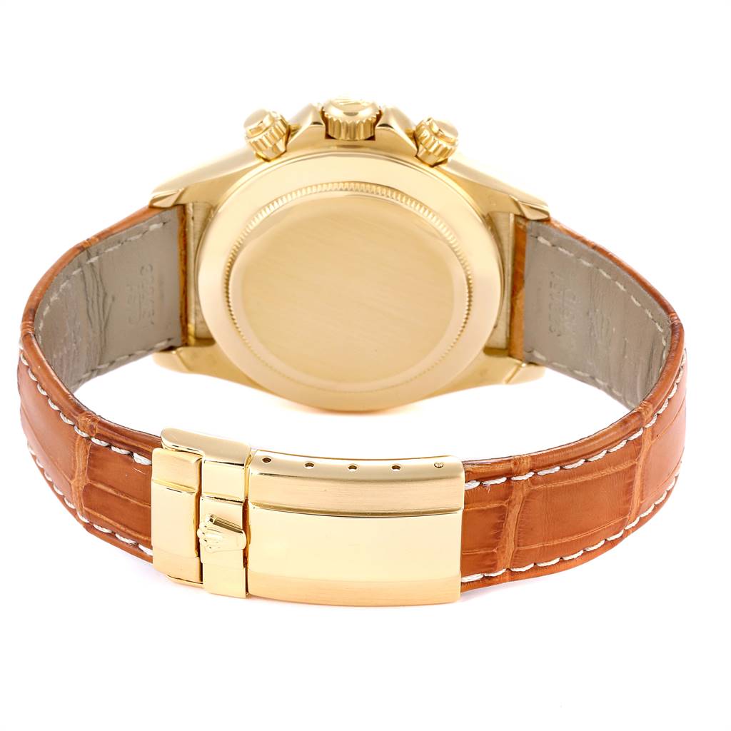 The image shows the back case and clasp of a Rolex Daytona 16518 Men's Yellow Gold White Dial 16518 Men's Yellow Gold White Dial watch, displayed at an angle highlighting the leather strap and gold clasp.