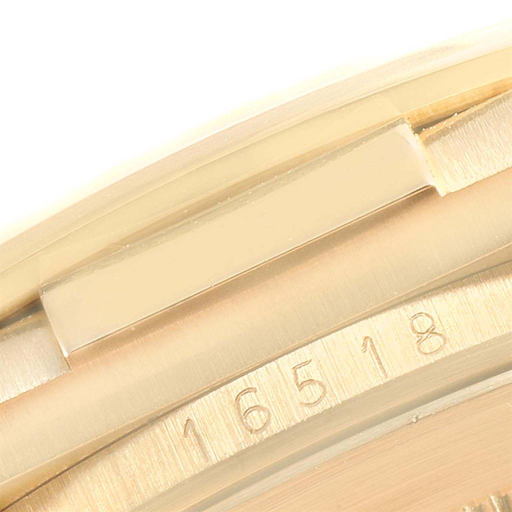 The image shows a close-up of the bezel and case parts of a Rolex Daytona 16518 Men's Yellow Gold White Dial 16518 Men's Yellow Gold White Dial watch, displaying the engraved numbers.