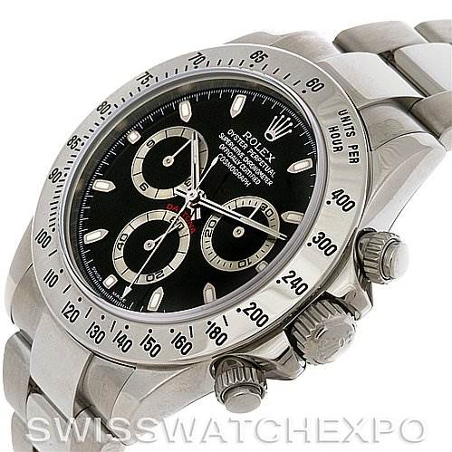 The image shows a tilted side view of a Rolex Daytona 116520 Men's Stainless Steel Black Dial 116520 Men's Stainless Steel Black Dial watch, focusing on the dial, bezel, and crown.